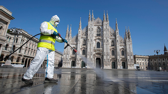 חיטוי איטליה נגיף קורונה מילאנו (צילום: AP)