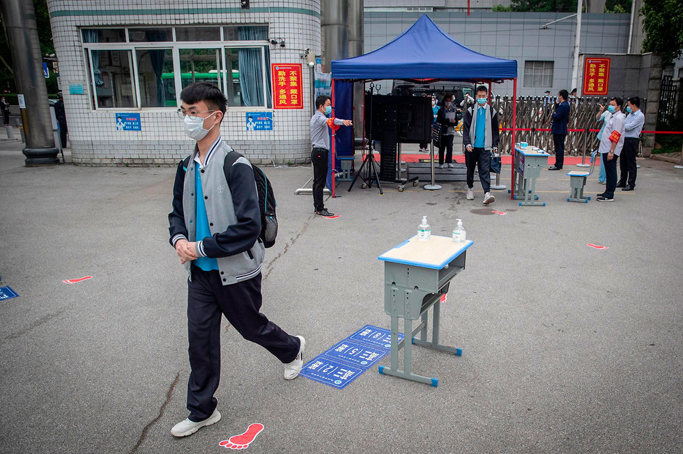 סין חזרה ללימודים בעיר ווהאן (צילום: AFP)