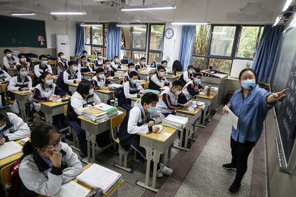 סין חזרה ללימודים בעיר ווהאן (צילום: AFP)