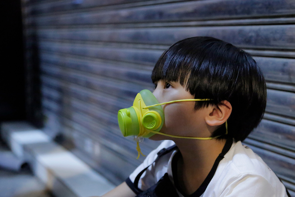 הונג קונג מסכה קורונה (צילום: AP)