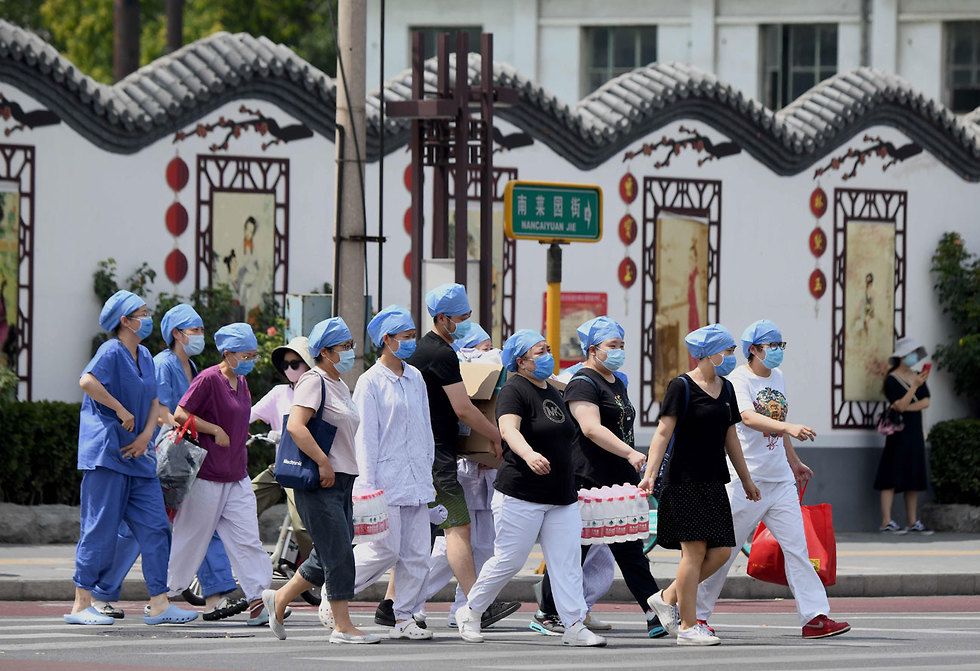 בדיקות קורונה ב בייג'ינג סין חשש מ התפרצות גל שני (צילום: AFP)