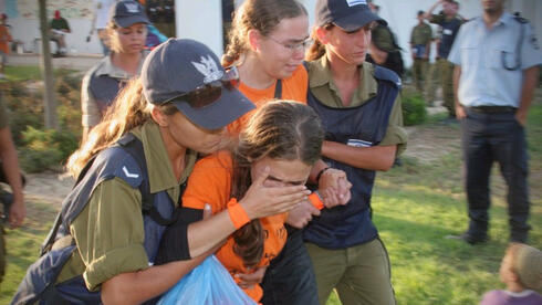 Soldiers remove young settlers from their homes as part of Israel's withdrawal from the Gaza Strip in 2005 