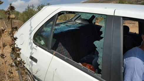 Palestinian farmer's car damaged in 2020 attack on oil farmers by Yitzhar settlers 