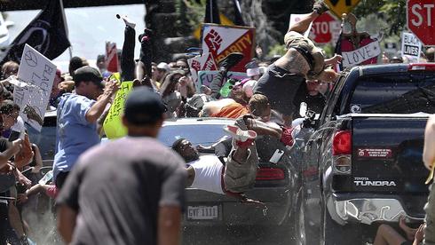 A white supremacist drives his car into anti-fascist protesters in Charlottesville, August 2017  (Photo: AP)