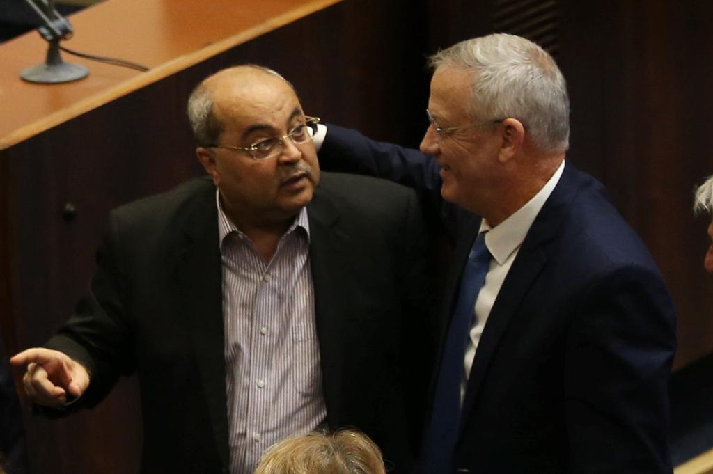 Gantz with Joint List leader Ahmad Tibi during Knesset plenum ()
