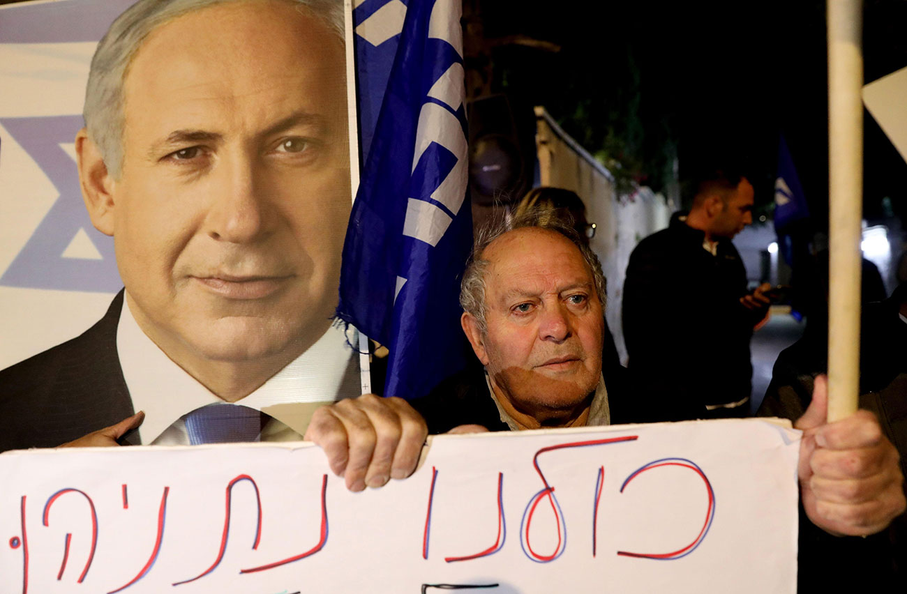 A protest in support of Benjamin Netanyahu after his indictment was announced  (Photo: AFP)