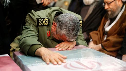 An Iranian official weeps at Qasem Soleimani's funeral procession in Tehran  (Photo: AFP)