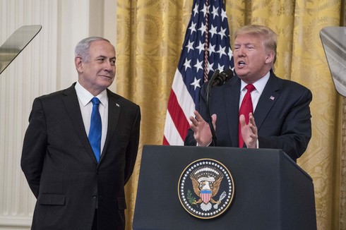 Benjamin Netanyahu looks on as Donald Trump unveils his Mideast peace plan at the White House  (Photo: Getty Images)