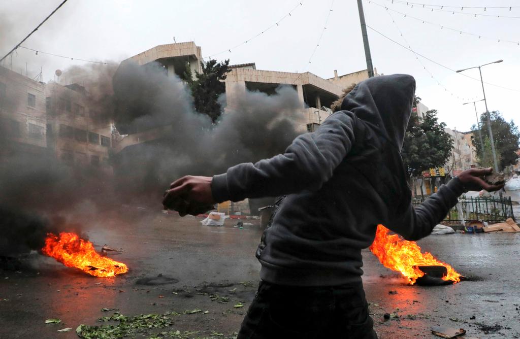 Palestinian rioter in the West Bank  ()