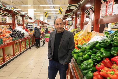 Рами Леви в своем магазине. Фото: AFP