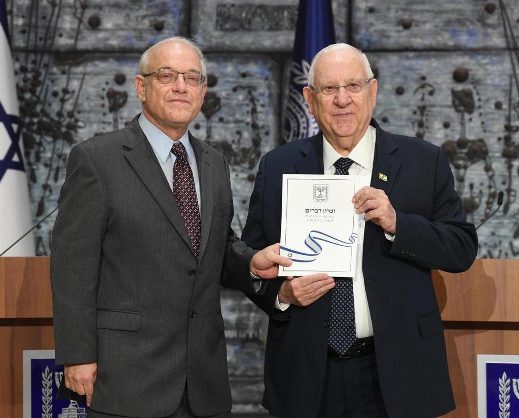 Central Elections Committee Chairman Neal Hendel (left) handing President Reuven Rivlin the official results of the election to the 23rd Knesset  ()