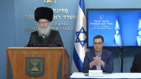 Outgoing health minister Yaakov Litzman and Health Ministry Director-General Moshe Bar Siman Tov  ()