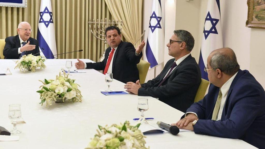 President Reuven Rivlin, left, meets with members of the Joint List, including Ayman Odeh, 2nd left  ()