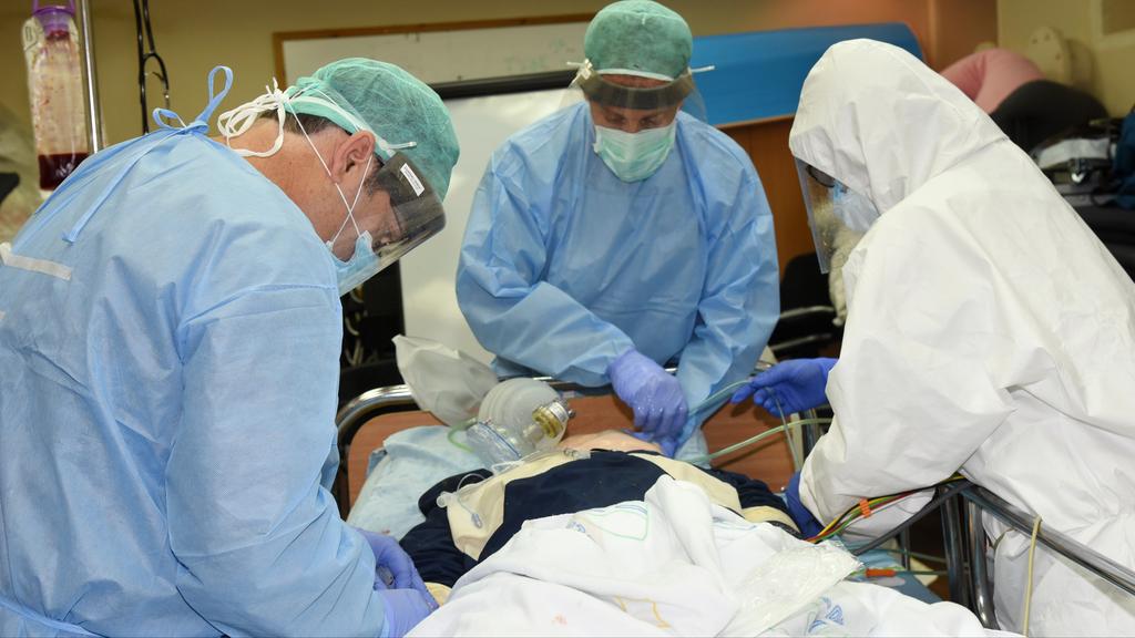 Medical staff at Soroka treating a coronavirus patient  ()