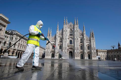 Disinfecting the street of Milan  (Photo: AP)