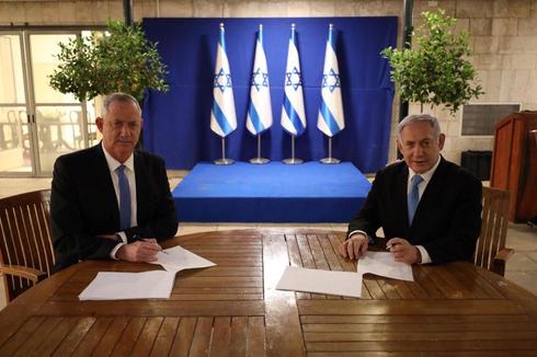 Blue & White Chairman Benny Gantz and Prime Minister Benjamin Netanyahu signing coalition deal ()
