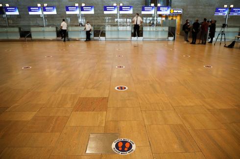 A social distancing marker is seen on the floor at the departures terminal at Ben Gurion Airport 