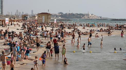 Tel Aviv beach was packed Tuesday  ()