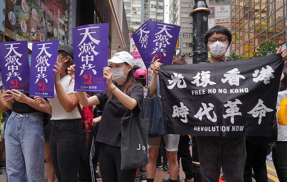Hong Kongers demonstrating against China national security legislation  ()