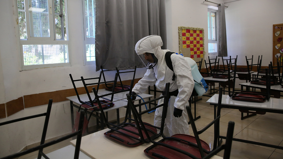 Disinfecting a Jerusalem school at the center of an outbreak of the virus  ()