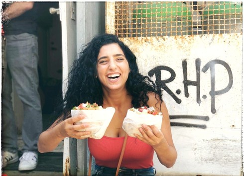 woman holding food for two