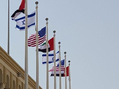 Israelis, American and Emirati flags flying at Abu Dhabi Airport (Photo: Foreign Ministry of Israel) דגלים ישראל ארה"ב ב נמל תעופה אבו דאבי איחוד האמירויות