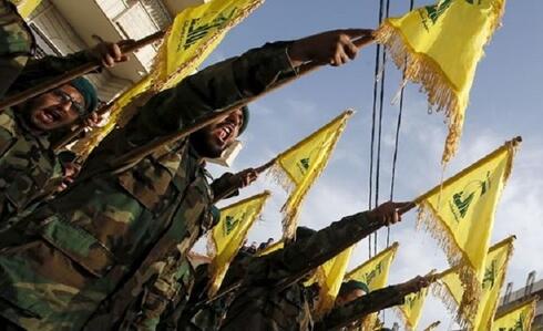 Fighters belonging to the Iran-backed Lebanese terror group Hezbollah (Photo: Reuters) Hezbollah fighters march in Lebanon
