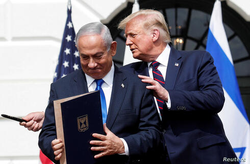 Prime Minister Benjamin Netanyahu stands with US President Donald Trump after signing Abraham Accords, at the White House 