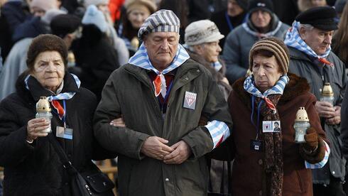 the survivors of the Naus death camp of Auschwitz arrive for a memorial service on International Holocaust Remembrance Day at the international memorial to the victims of Fascism inside Auschwitz-Birkenau in Oswiecim , Poland 