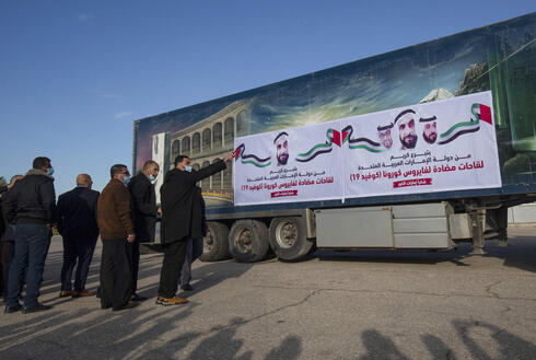 A truck loaded with Russian-made Sputnik V doses from the UAE arrives on February 21, 2021 via the Rafah crossing with Egypt in the Gaza Strip.  About 20,000 doses of coronavirus vaccine from the UAE arrived in Gaza today, a delivery reportedly made by a rival of Palestinian President Mahmoud Abbas three months before the scheduled Palestinian election. 