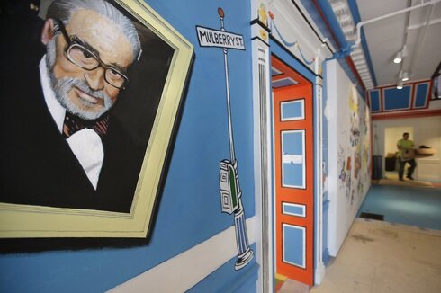 wall featuring Theodor Seuss Geisel, left, also known by his pen name Dr. Seuss, covering part of a wall near an entrance at the Amazing World of the Dr. Seuss Museum, in Springfield, Mass. . 
