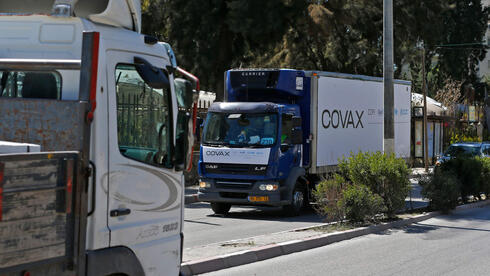 A refrigerated truck loaded with the first delivery of coronavirus vaccine via the United Nations Covax program that supports poorer areas will drive to the West Bank city of Ramallah on March 17, 2021. 