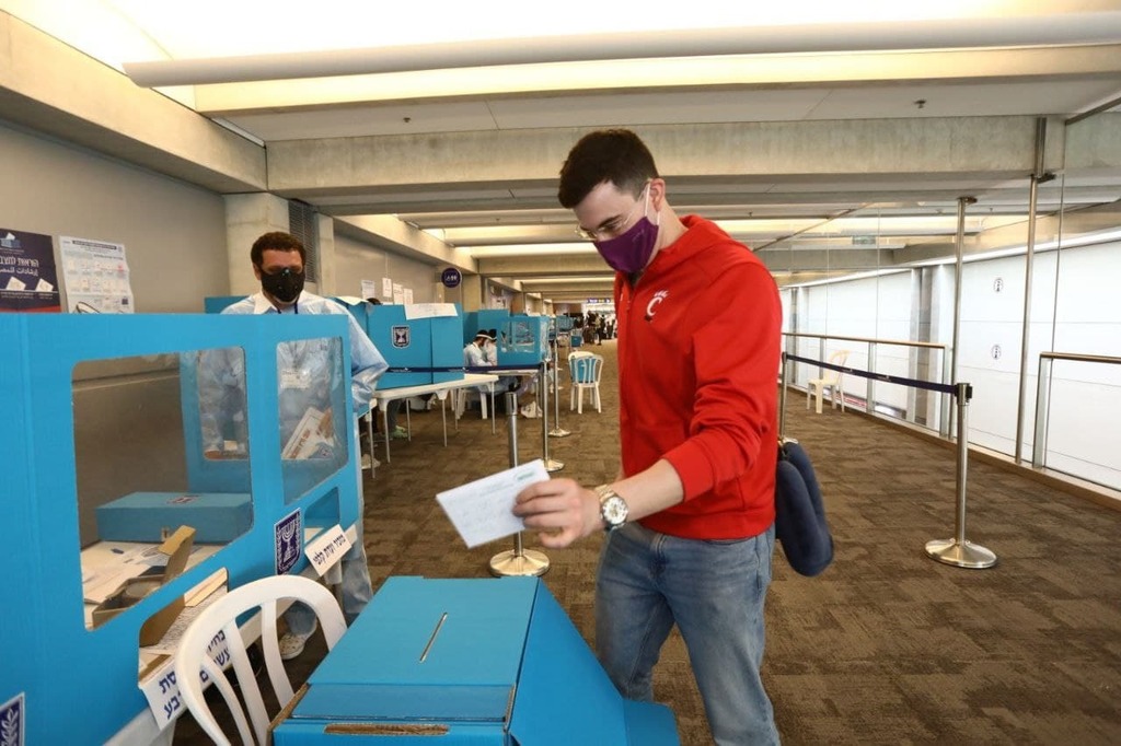 Those landing on the flight from New York point to the ballot box on the router